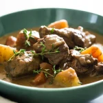 irish lamb stew bowl with potatoes and carrots